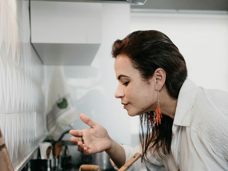 A woman cooking a meal at home