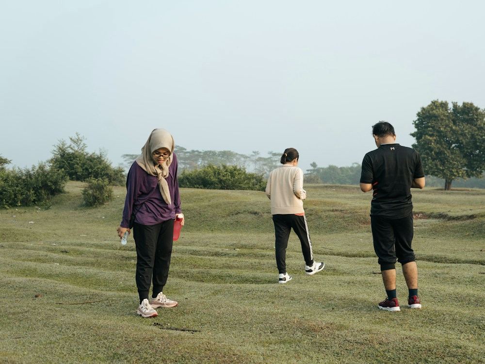 Two people walking together across a field